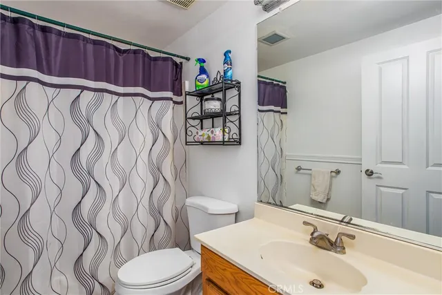 a view of a house with a yard and lake view