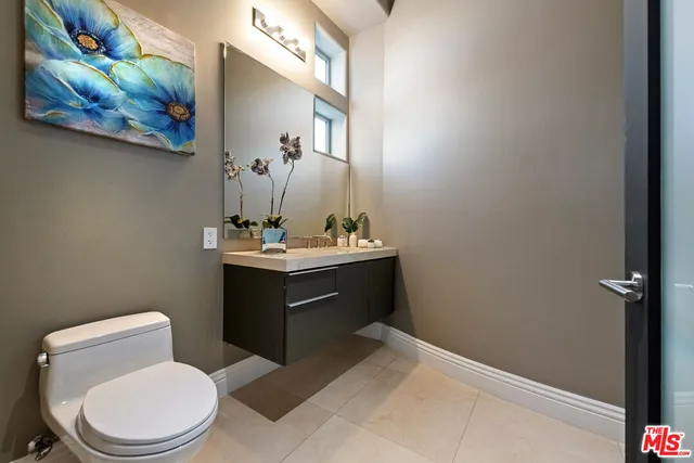 a bedroom with furniture and a flat screen tv