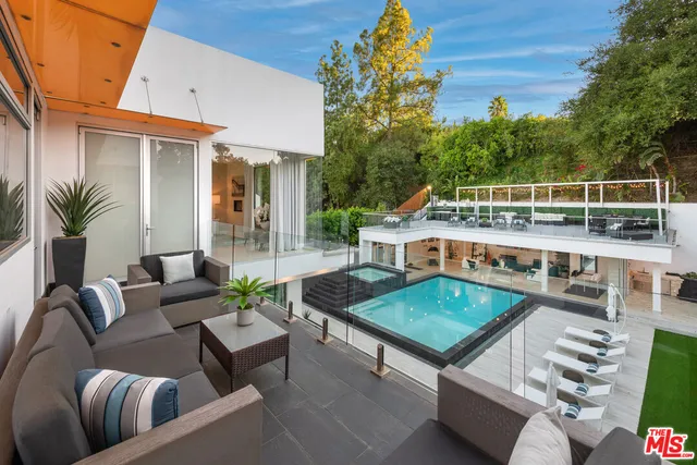 a view of a swimming pool with a patio