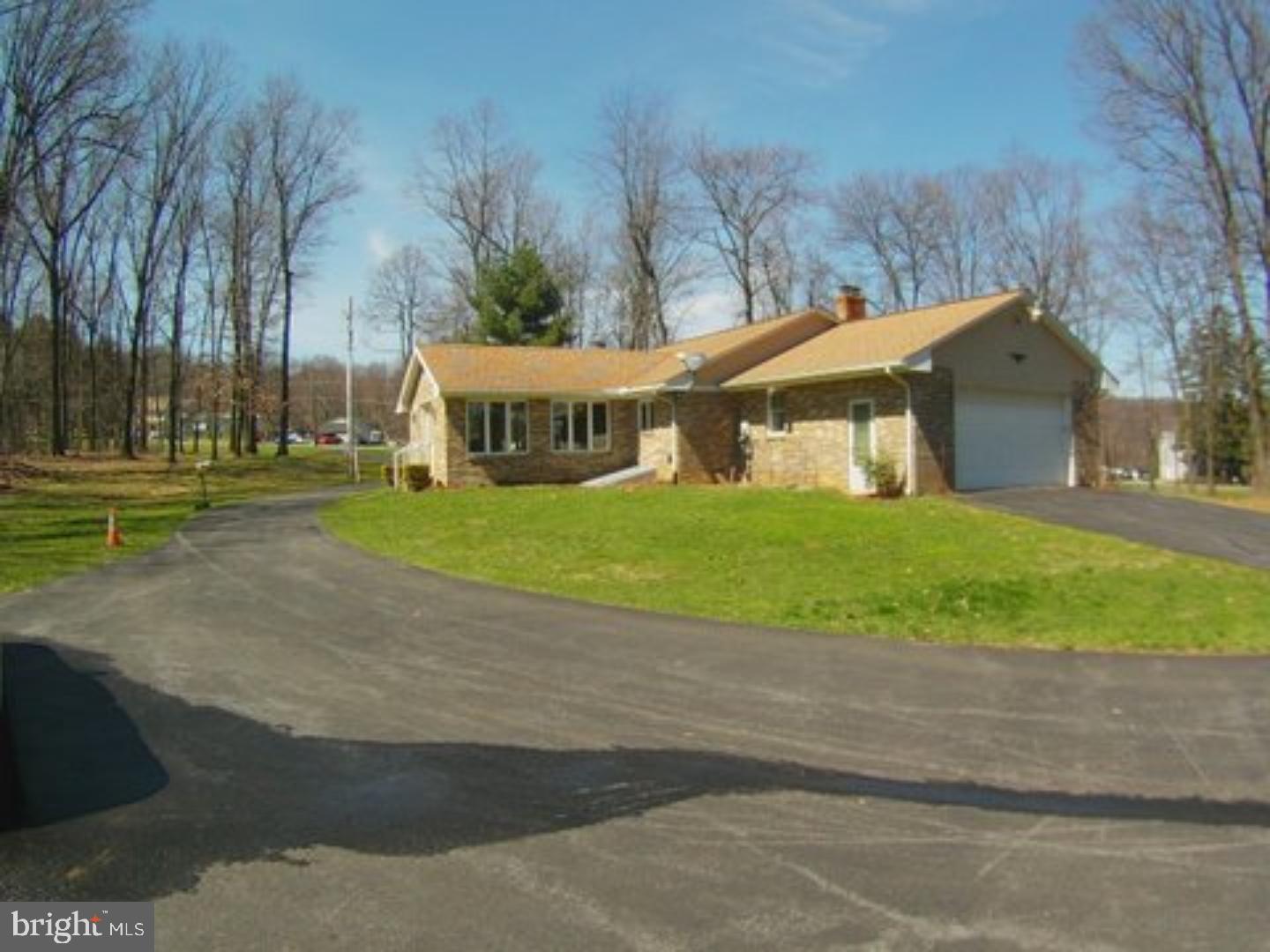 41 Cocalico Road Robesonia, PA 19551 - Photo 14 of 16 a view of a white house with a big yard and large trees