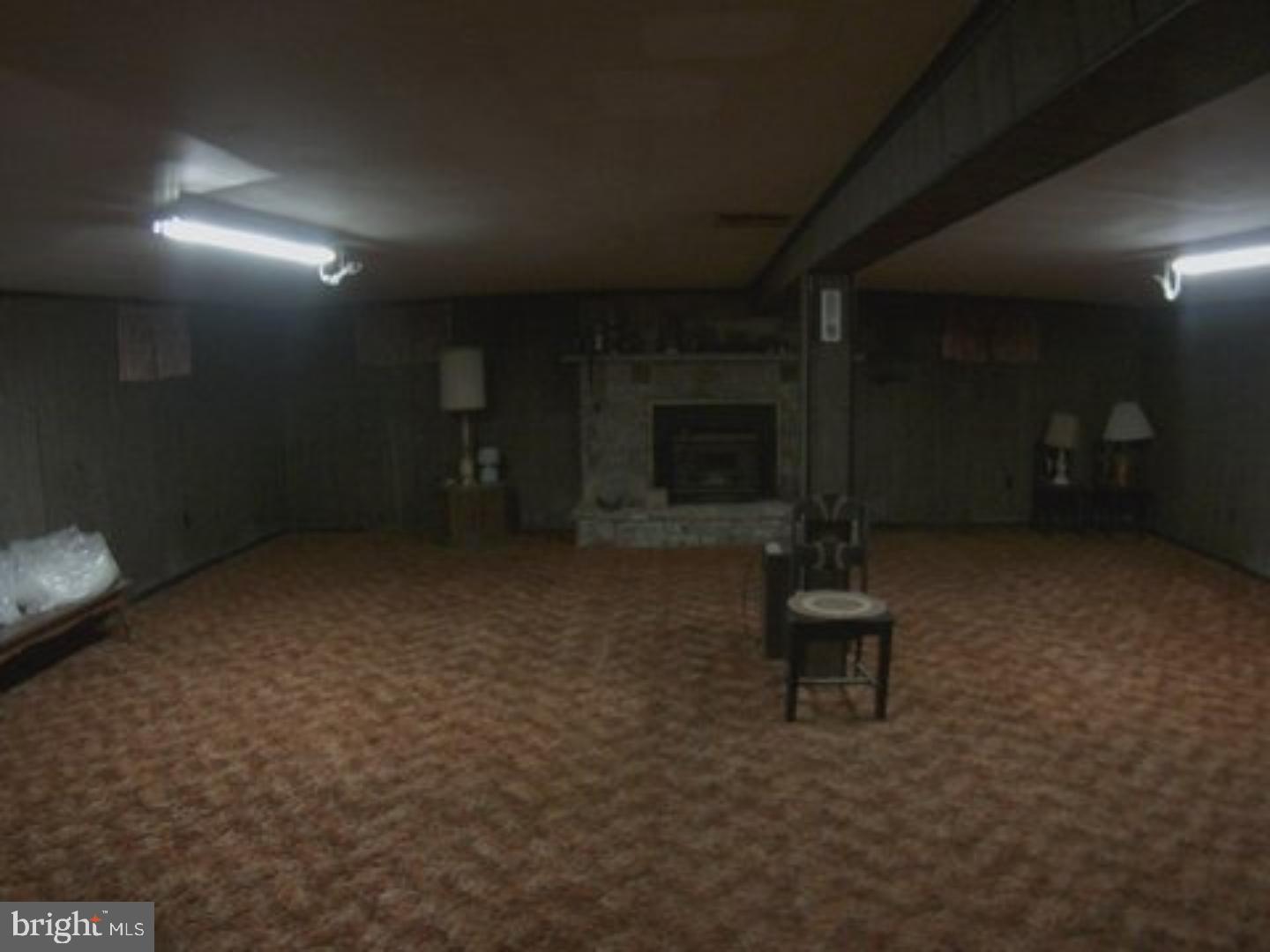 41 Cocalico Road Robesonia, PA 19551 - Photo 3 of 16 an empty room with a fireplace
