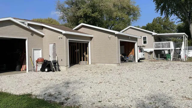 a view of a house with large outdoor space and porch