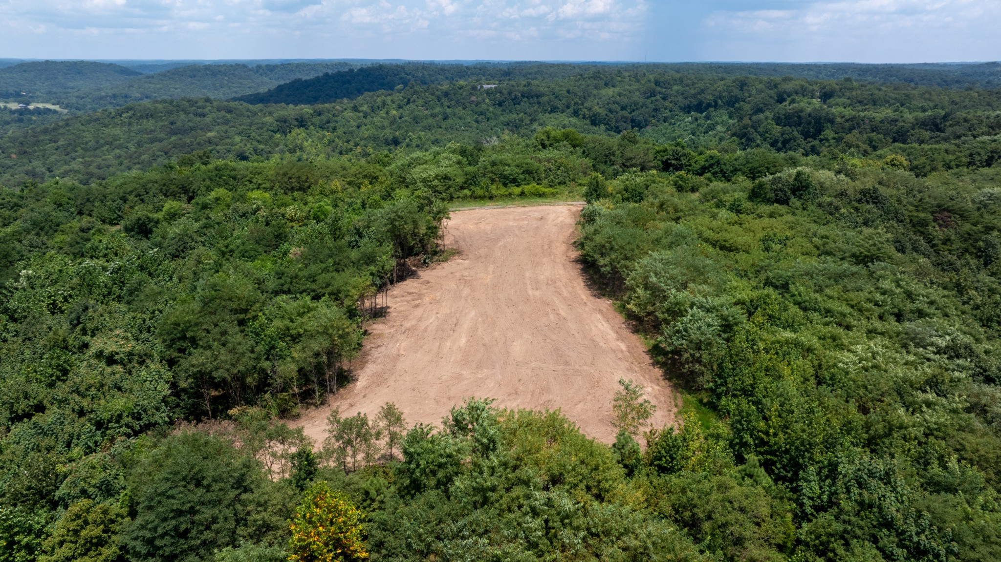 555 New Era Bluff Road Linden, TN 37096 - Photo 12 of 64 a view of a pathway both side of grassy field with trees