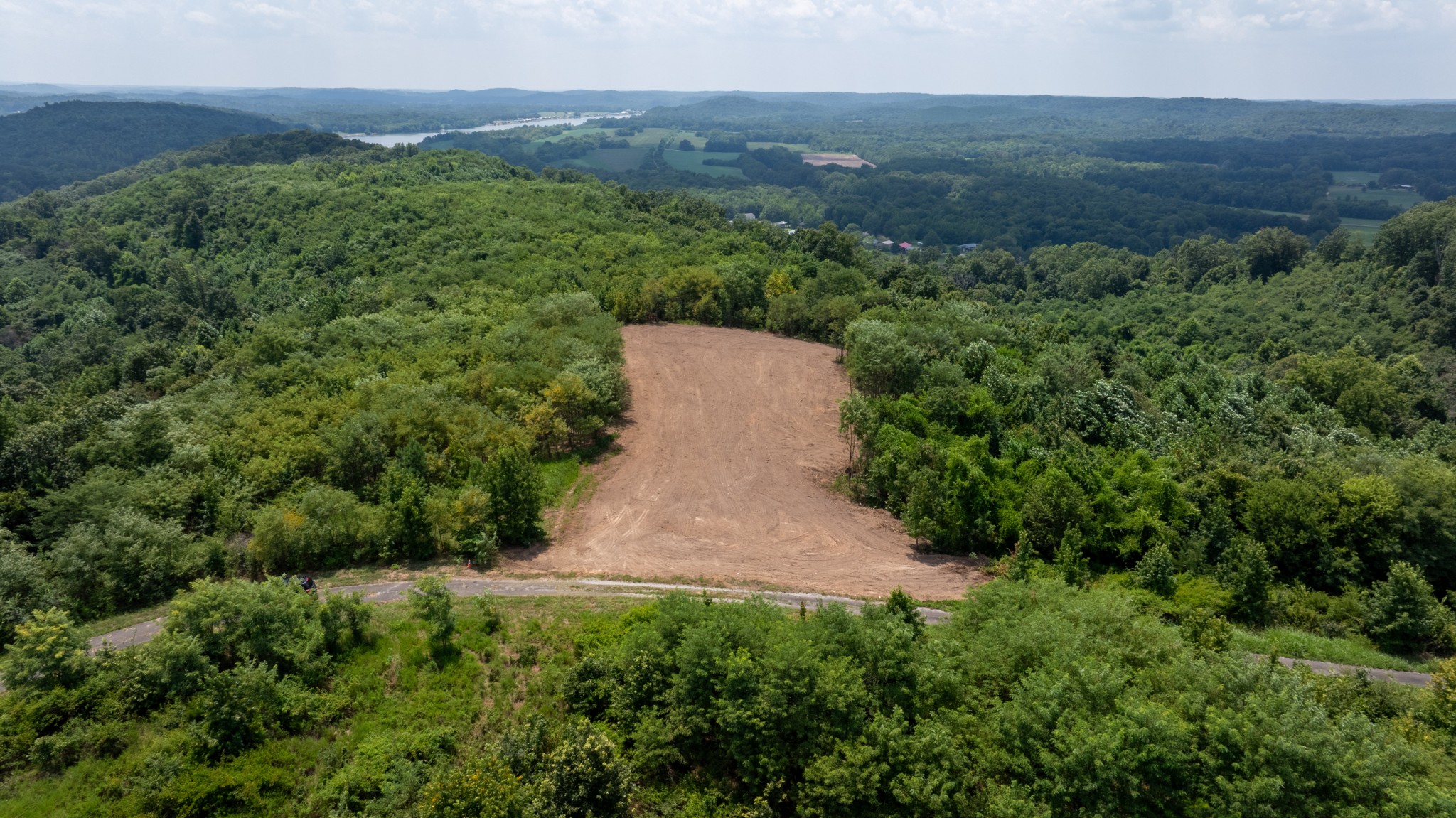 555 New Era Bluff Road Linden, TN 37096 - Photo 15 of 64 an aerial view of a house with a yard and lake view