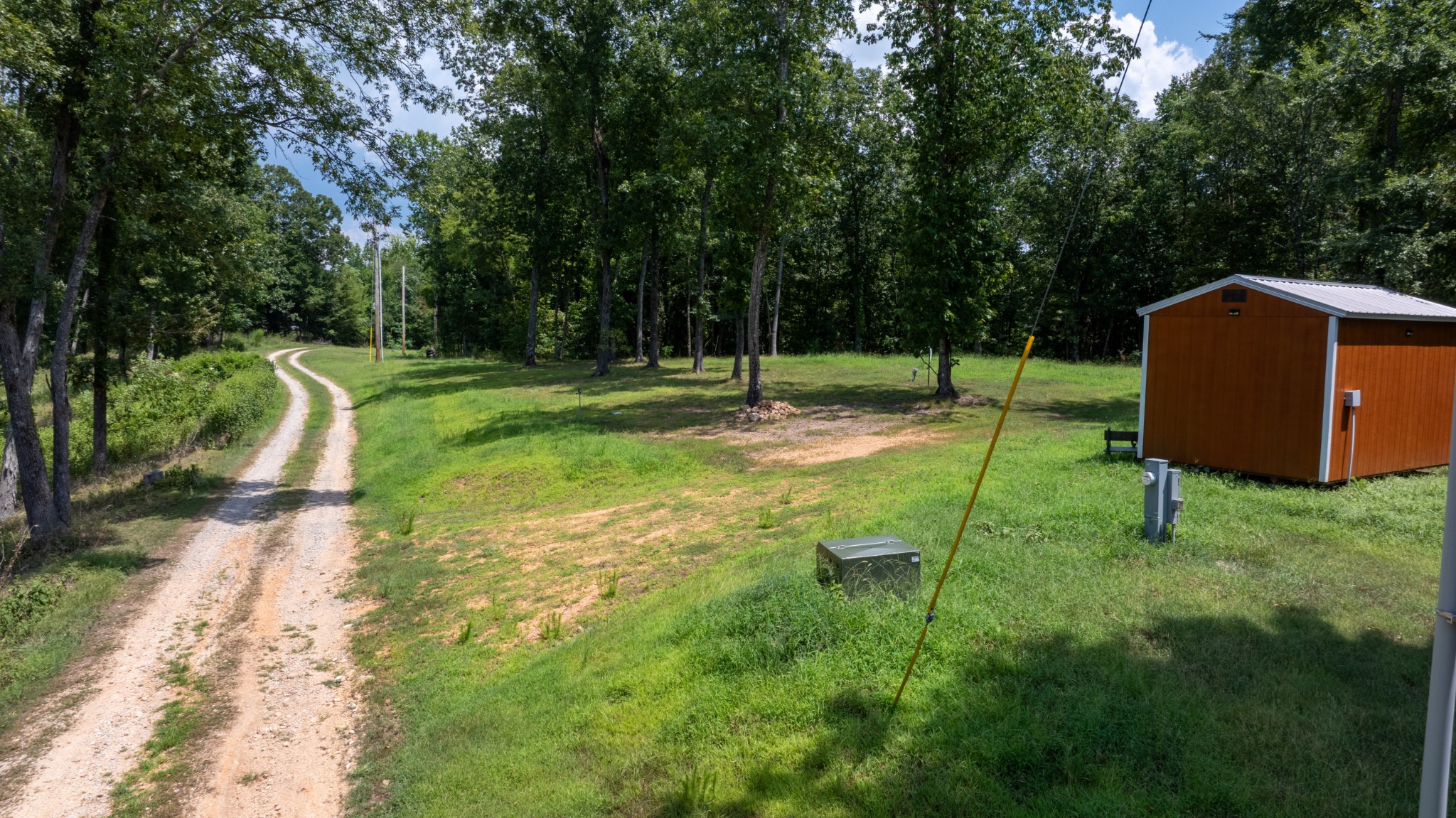 555 New Era Bluff Road Linden, TN 37096 - Photo 26 of 64 a view of a backyard with a barn