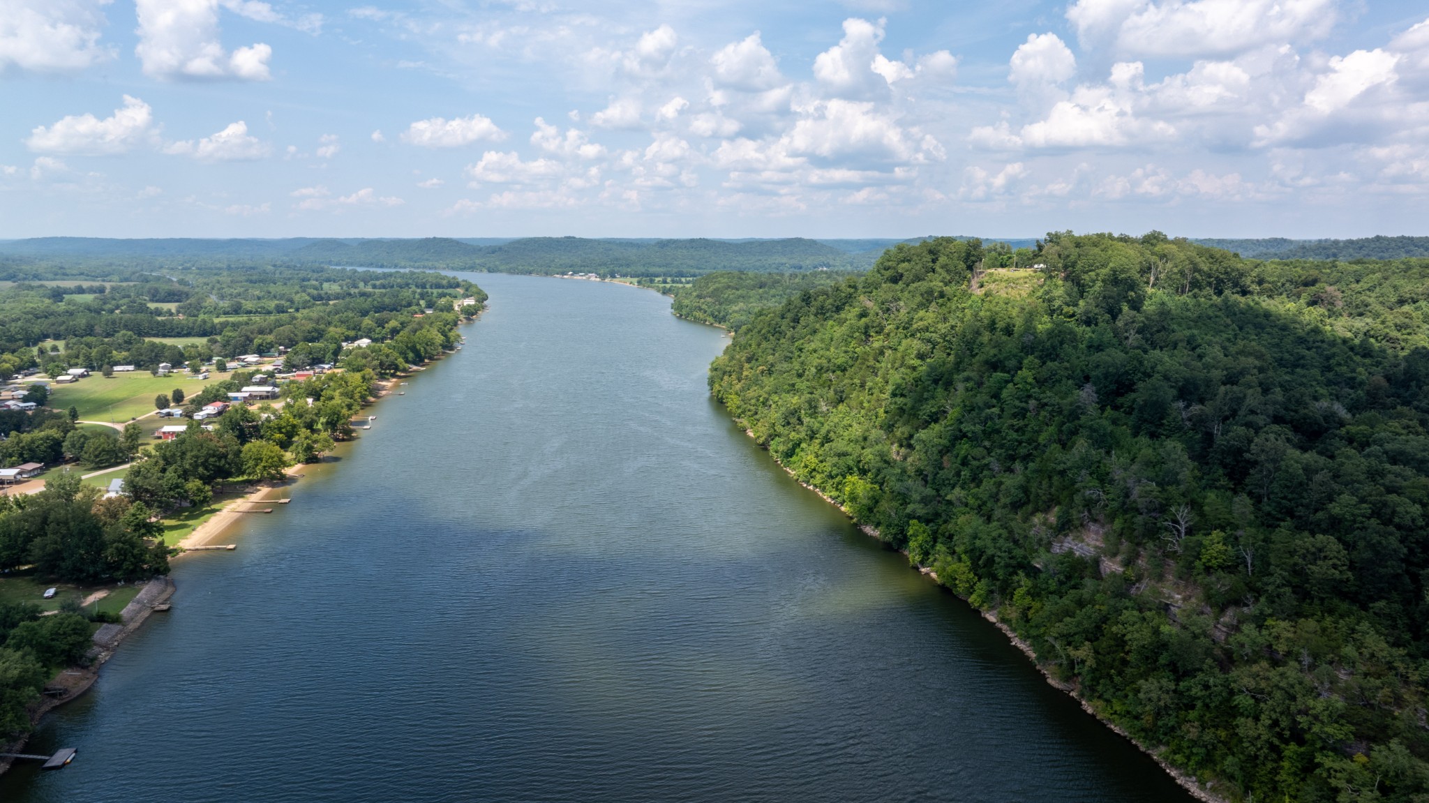555 New Era Bluff Road Linden, TN 37096 - Photo 41 of 64 a view of a lake with houses in back