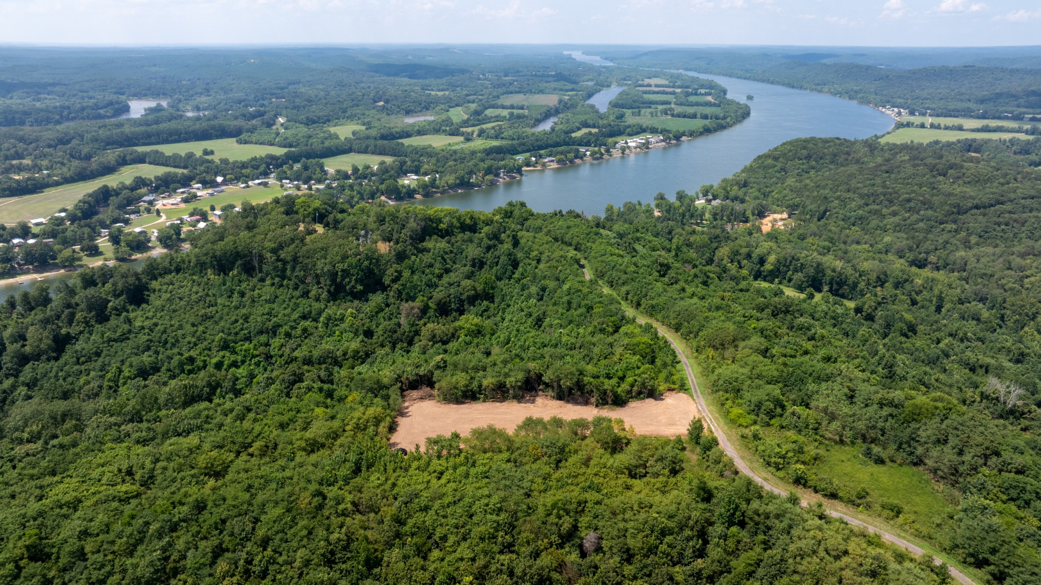 555 New Era Bluff Road Linden, TN 37096 - Photo 46 of 64 an aerial view of residential house with outdoor space and trees all around