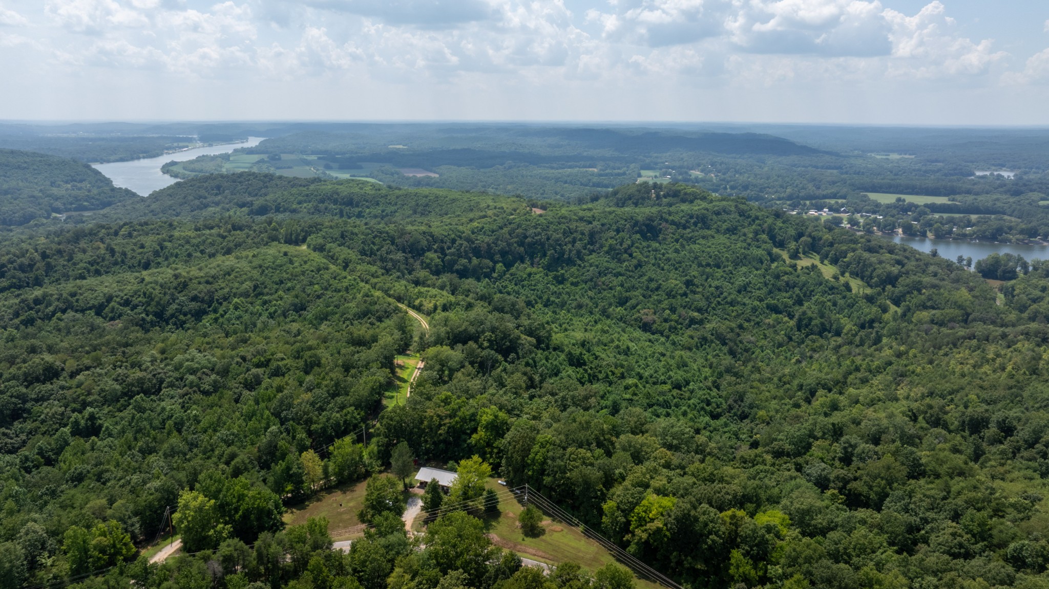 555 New Era Bluff Road Linden, TN 37096 - Photo 49 of 64 a view of a big yard with lots of green space and mountain view in back