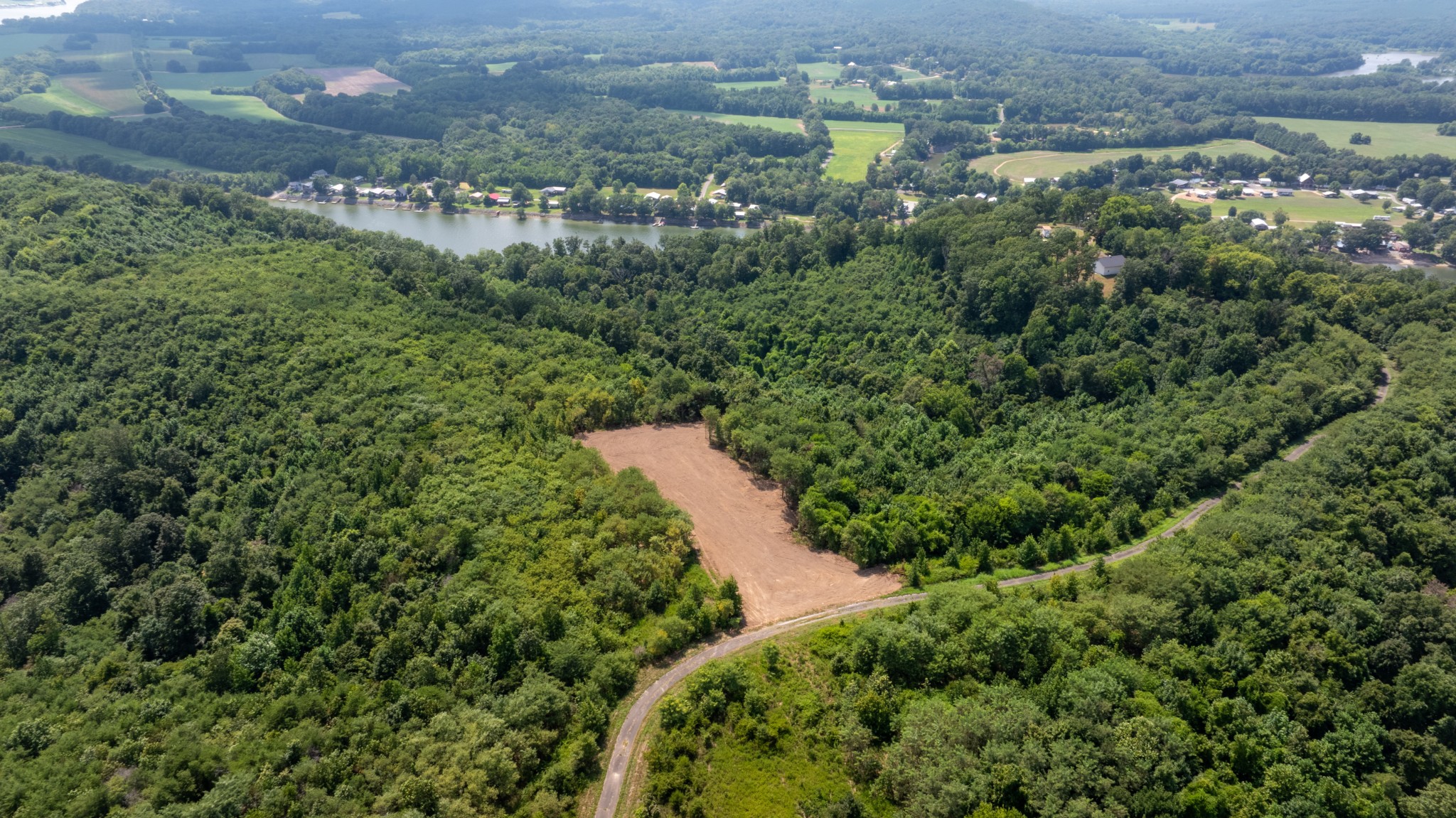 555 New Era Bluff Road Linden, TN 37096 - Photo 57 of 64 an aerial view of residential house with outdoor space and trees all around