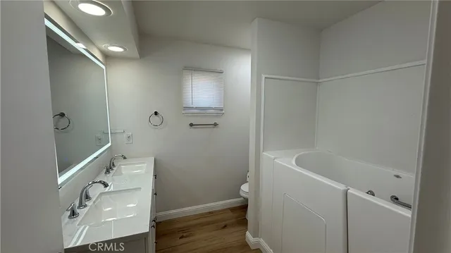 a bathroom with a tub and sink