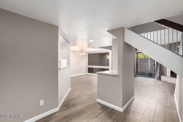 3030 North Hayden Road, Unit 16 Scottsdale, AZ 85251 - Photo 2 of 30 a view of a living room with furniture and a flat screen tv