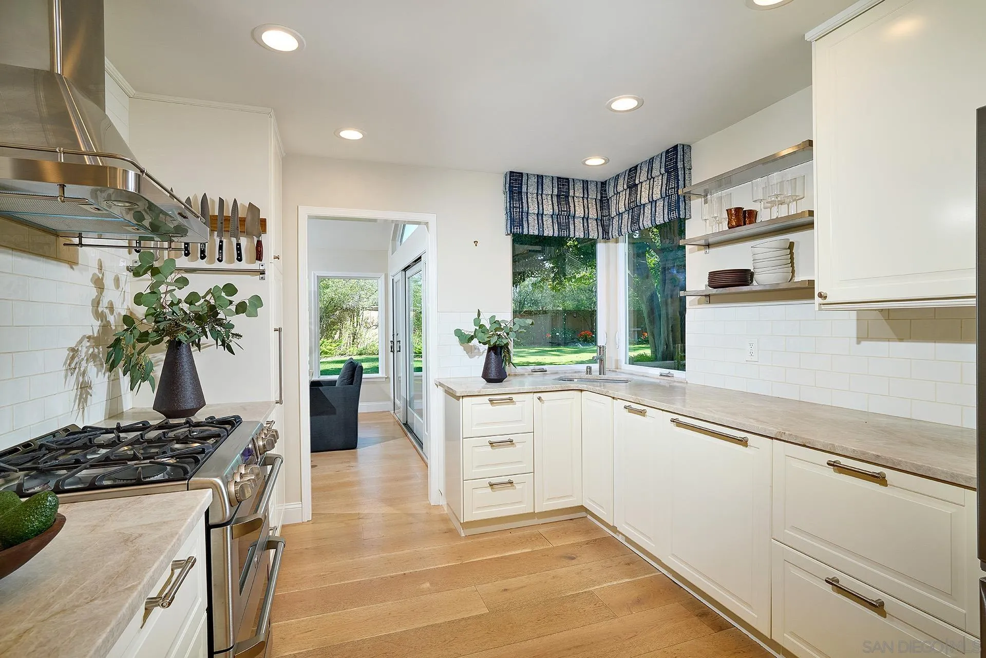 1229 Swallowtail Court Encinitas, CA 92024 - Photo 14 of 36 a kitchen with a sink stove and cabinets