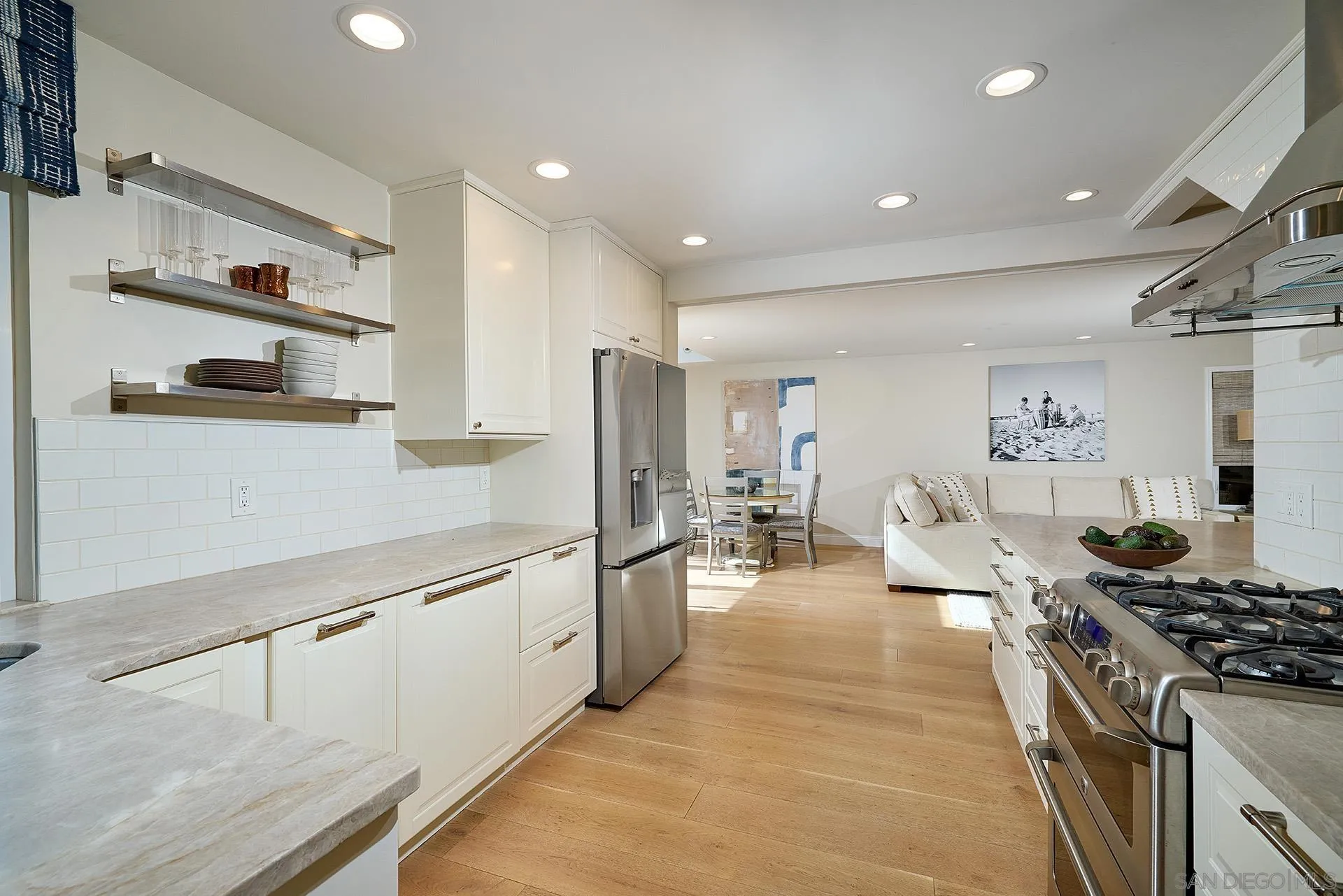 1229 Swallowtail Court Encinitas, CA 92024 - Photo 15 of 36 a kitchen with stainless steel appliances granite countertop a lot of counter top space and cabinets