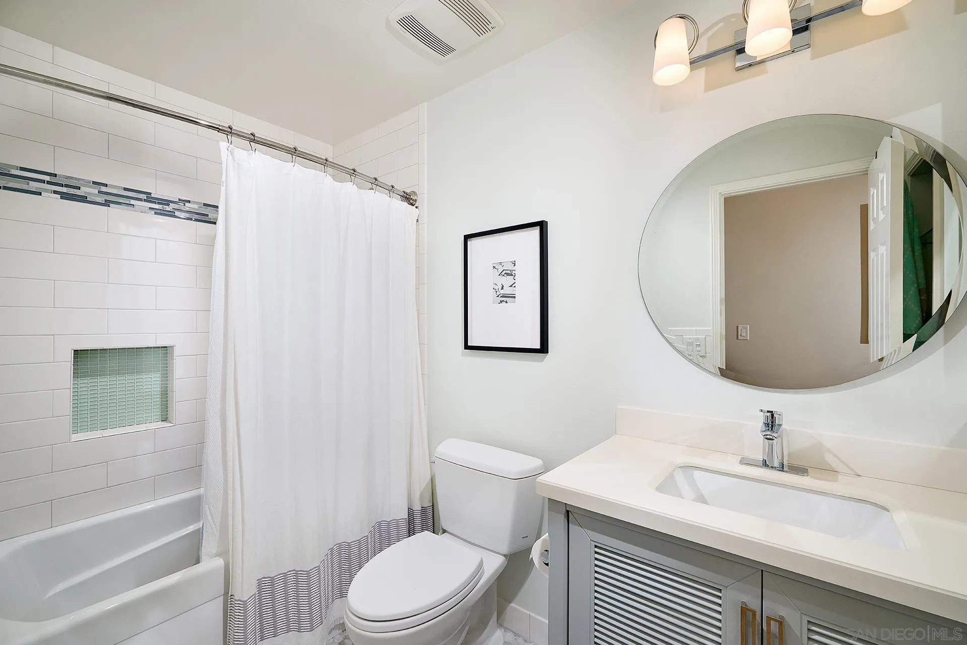 1229 Swallowtail Court Encinitas, CA 92024 - Photo 24 of 36 a bathroom with a sink a toilet and shower