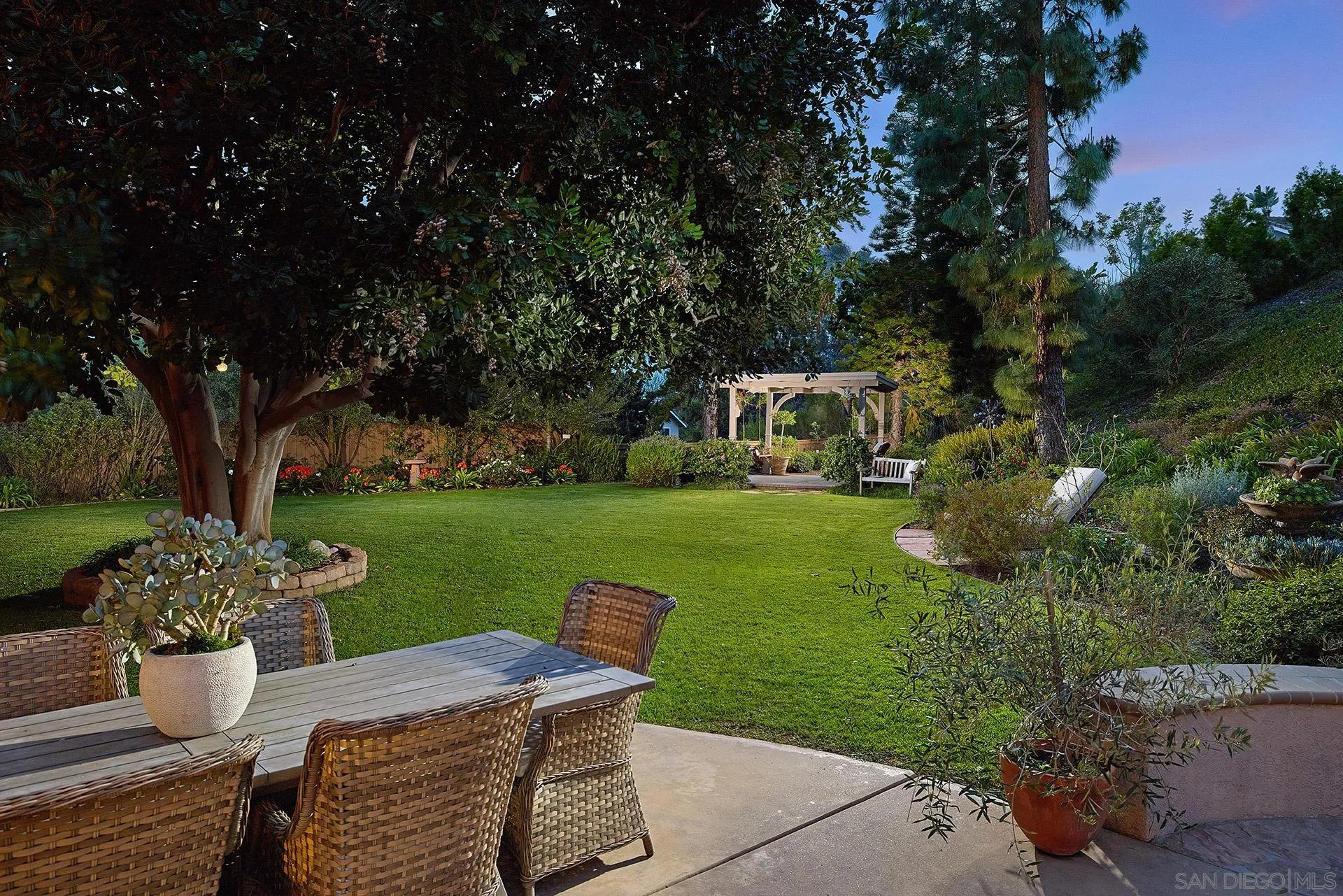 1229 Swallowtail Court Encinitas, CA 92024 - Photo 28 of 36 a view of a house with backyard sitting area and garden