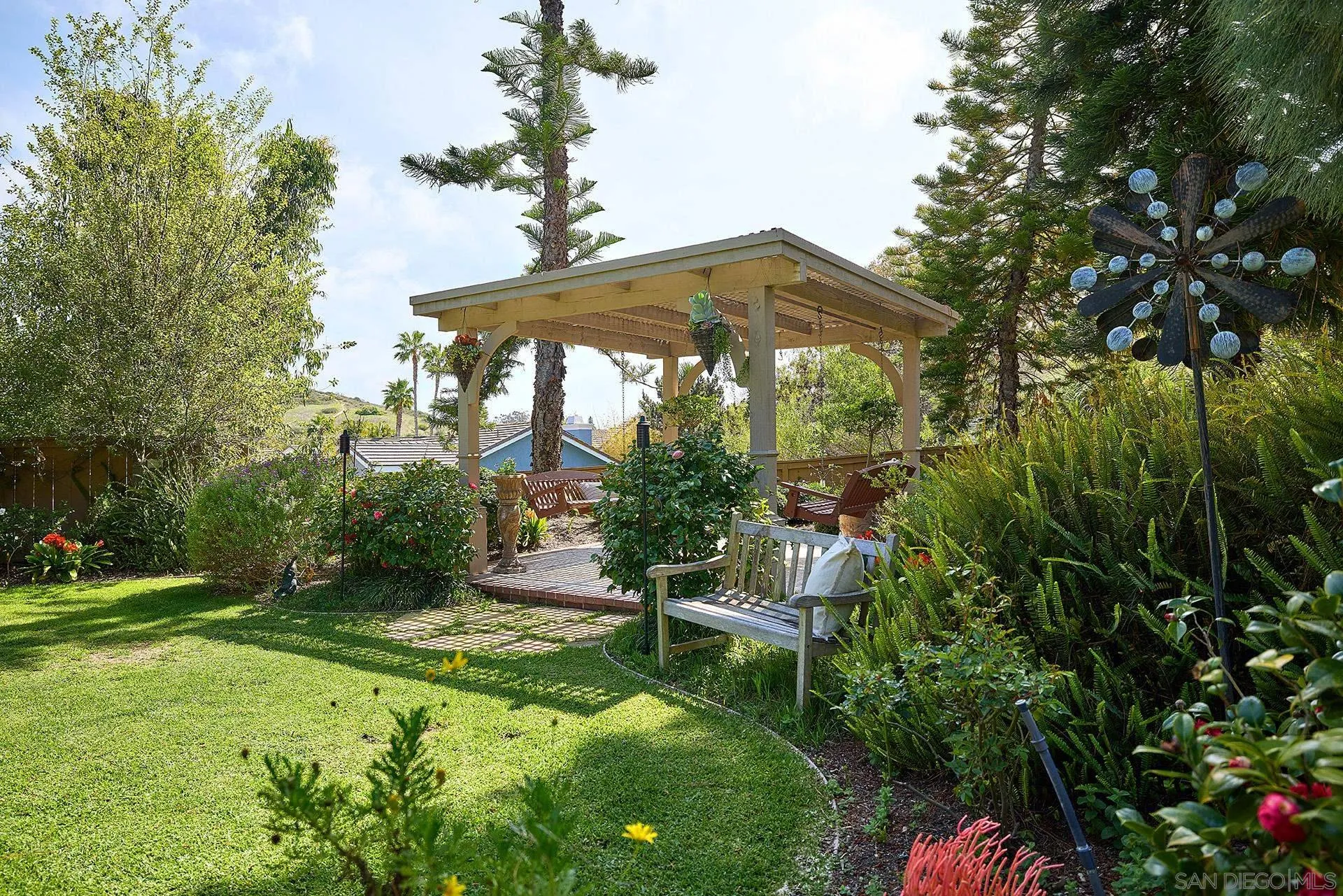 1229 Swallowtail Court Encinitas, CA 92024 - Photo 29 of 36 a view of a chair and table in the garden