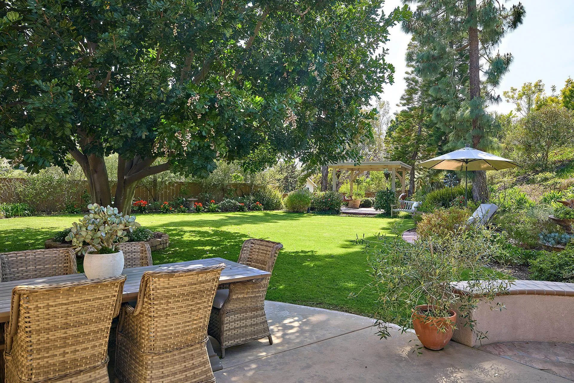 1229 Swallowtail Court Encinitas, CA 92024 - Photo 32 of 36 a view of a table and chairs under an umbrella