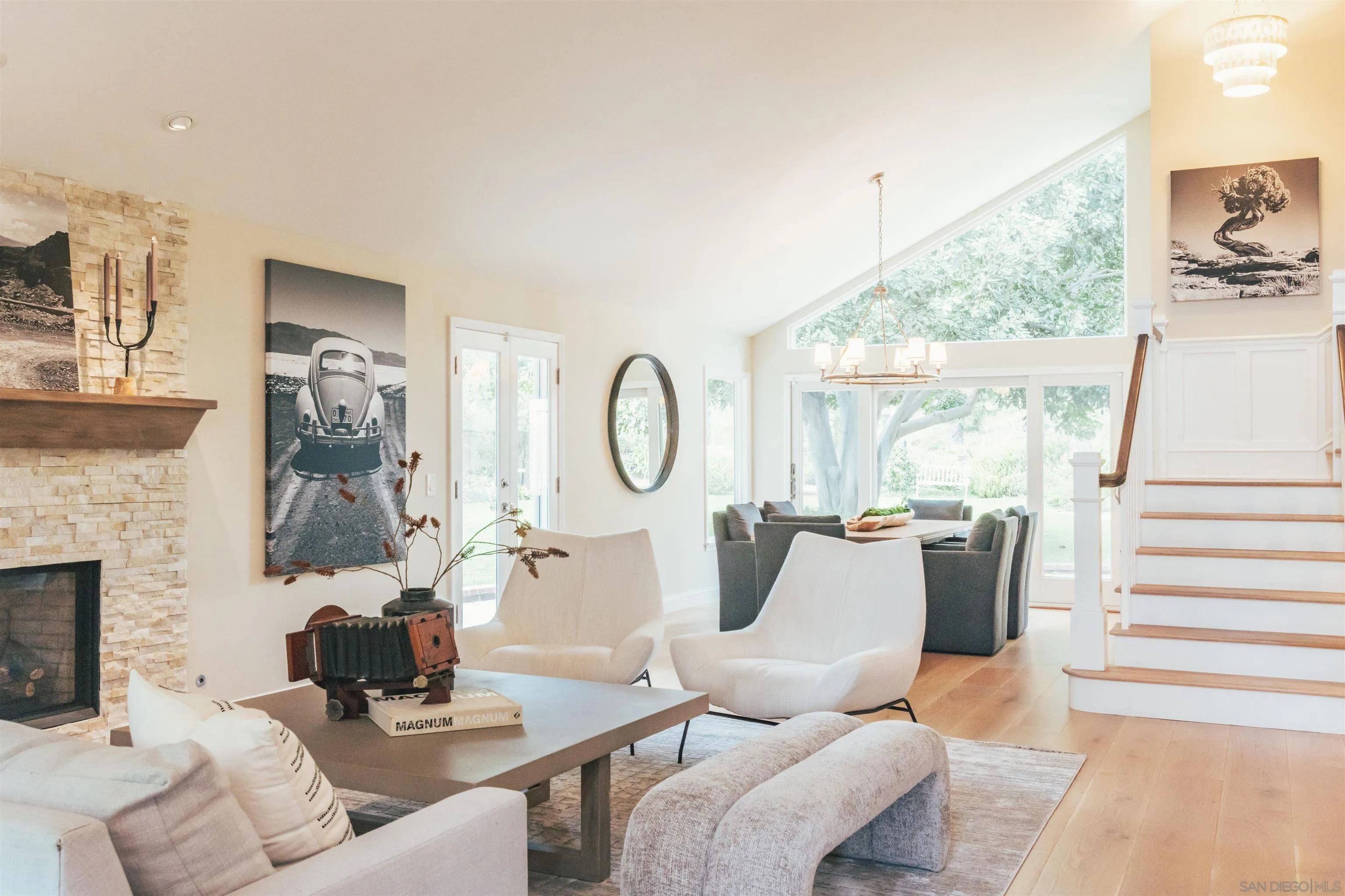 1229 Swallowtail Court Encinitas, CA 92024 - Photo 8 of 36 a living room with furniture a fireplace and a large window