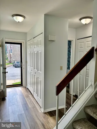 a view of an entryway with wooden floor