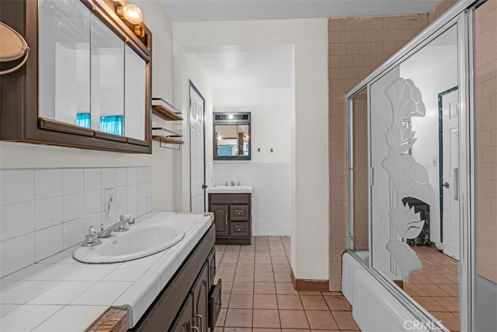 1625 North Maple Street Burbank, CA 91505 - Photo 14 of 30 a bathroom with a sink a toilet and shower