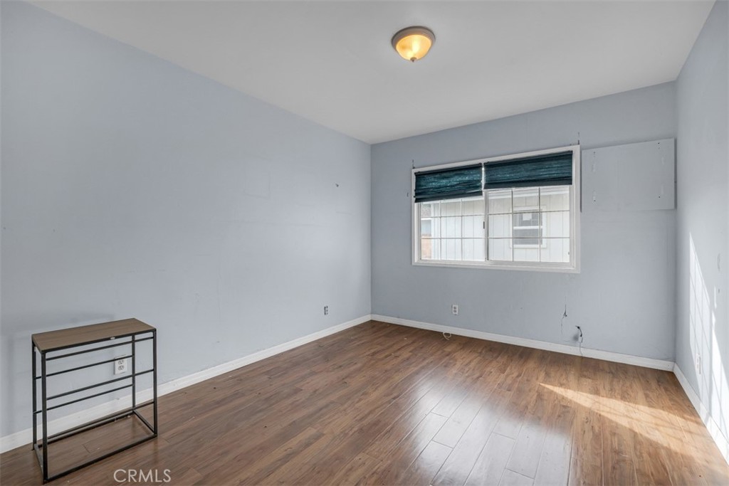 1625 North Maple Street Burbank, CA 91505 - Photo 19 of 30 wooden floor in an empty room with a window