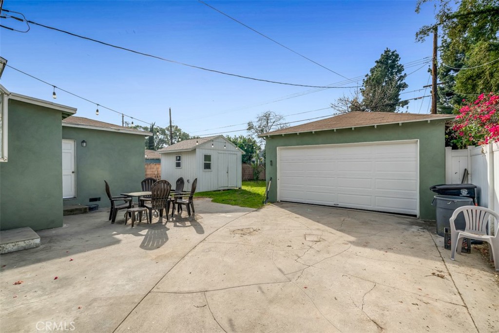 1625 North Maple Street Burbank, CA 91505 - Photo 21 of 30 a view of a patio with table and chairs and potted plants