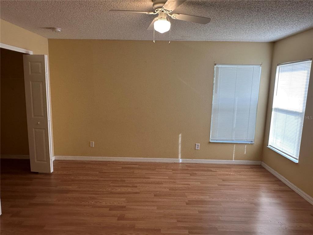 1105 Hill Mount Drive Minneola, FL 34715 - Photo 12 of 12 a view of an empty room with wooden floor and a window