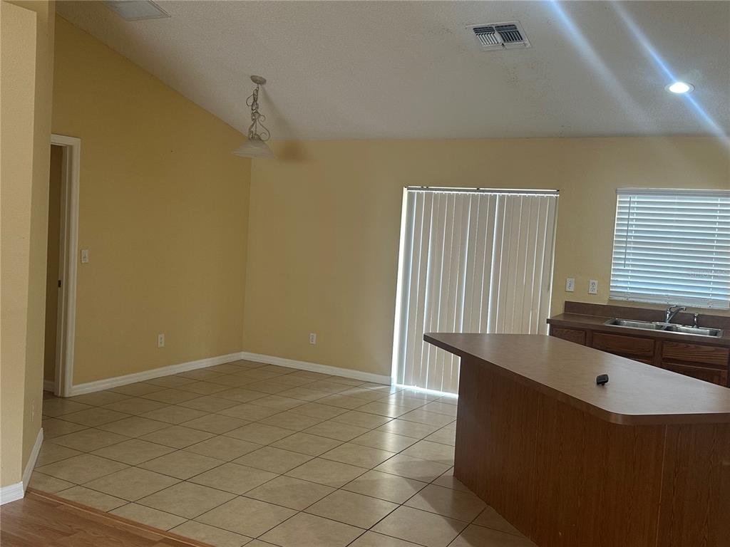 1105 Hill Mount Drive Minneola, FL 34715 - Photo 7 of 12 an empty room with windows