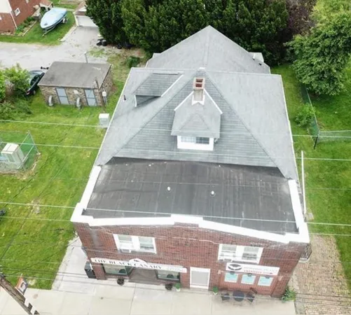 an aerial view of houses with yard