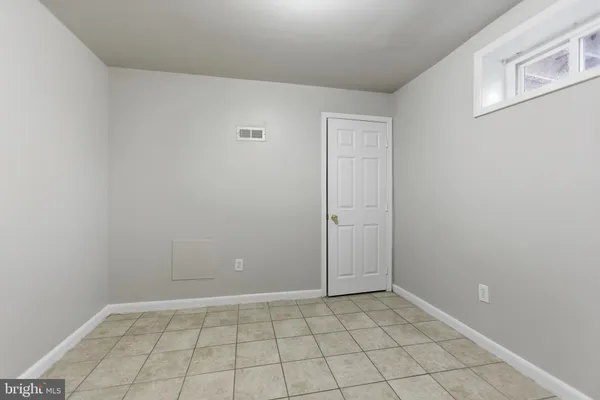 a kitchen with granite countertop a stove and a sink