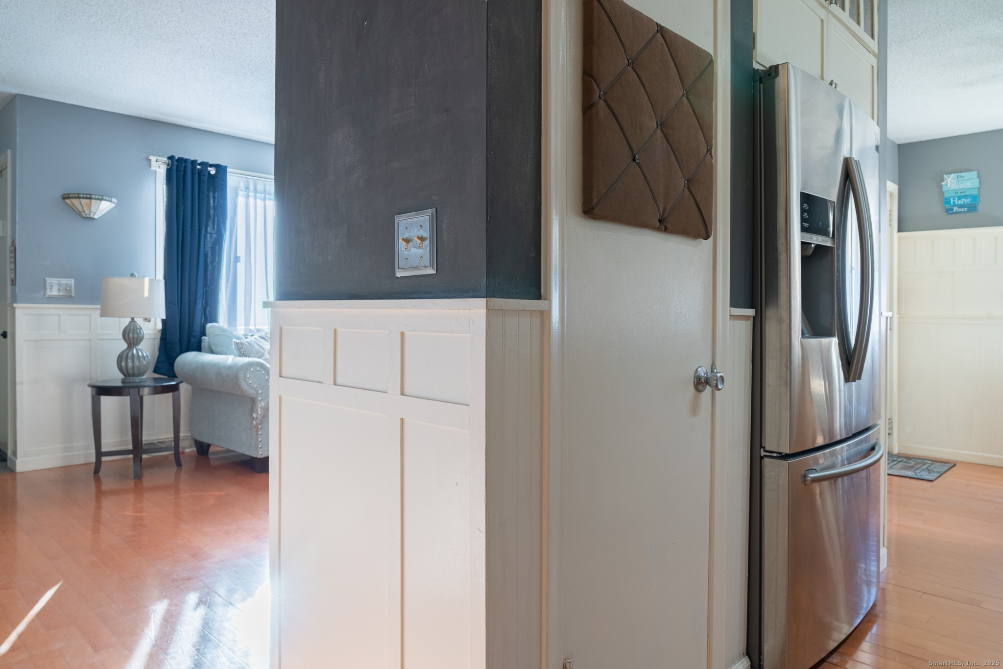 238 Shagbark Drive, Unit 238 Derby, CT 06418 - Photo 12 of 25 a view of hallway with furniture and a refrigerator