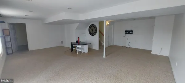 a view of a livingroom and a ceiling fan