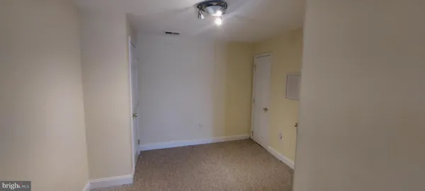 an empty room that has a window in it