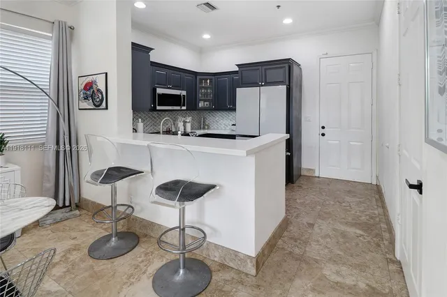 a view of staircase with wooden floor and a window
