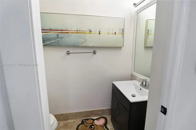 a bathroom with a sink double vanity and a mirror