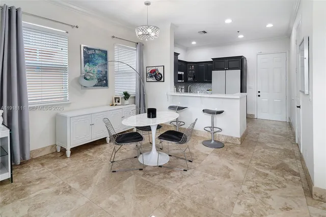 a kitchen with stainless steel appliances a stove sink and microwave