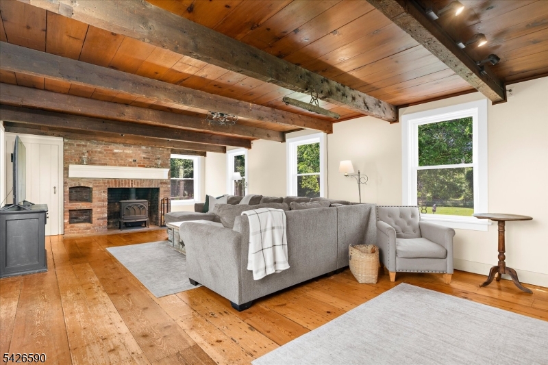 179 Lindbergh Road Hopewell, NJ 08525 - Photo 5 of 46 a living room with furniture and a fireplace