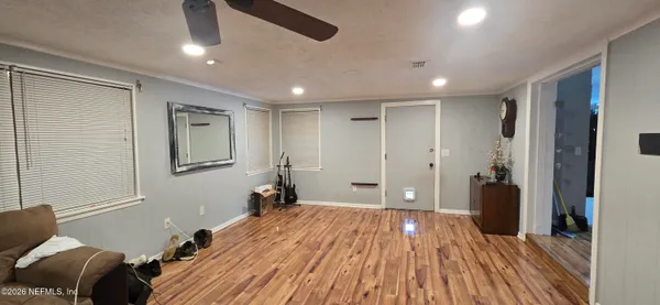a living room with a bed and furniture