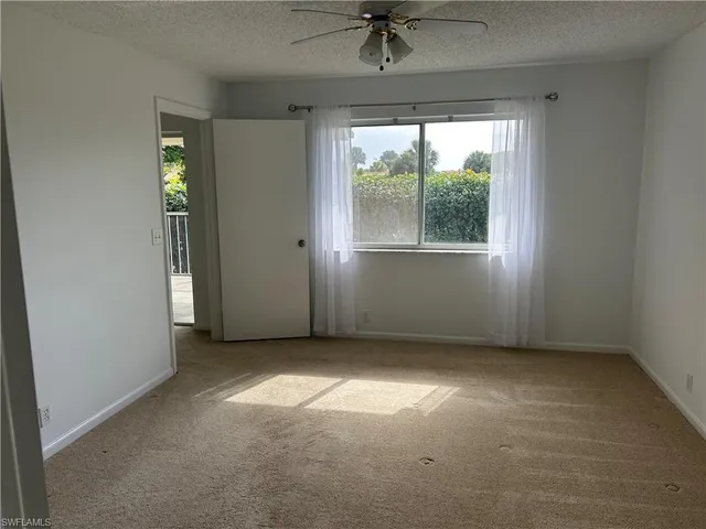 an empty room that has a window