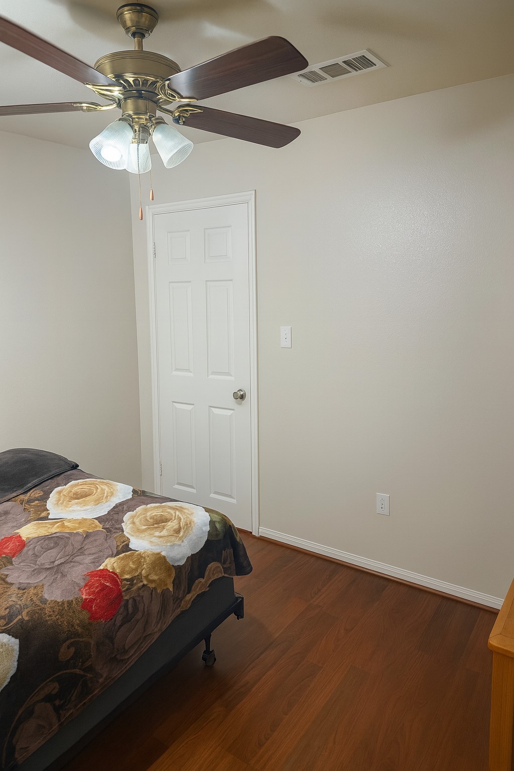 3335 Bandell Drive Houston, TX 77045 - Photo 11 of 16 a bedroom with a bed and a chandelier