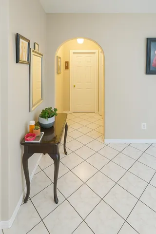 a living room with a table and chair