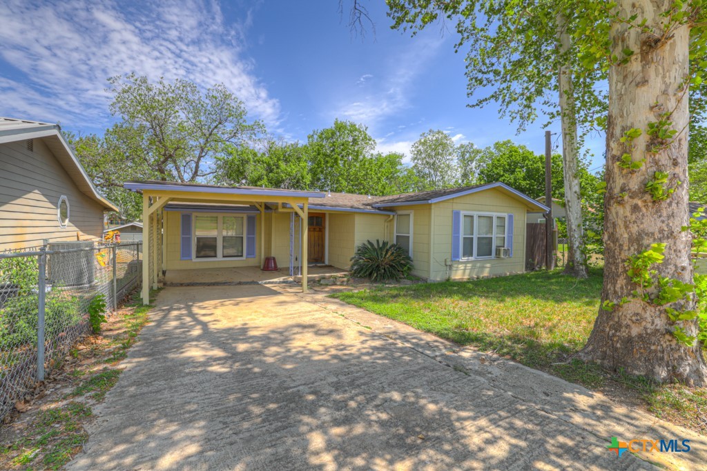 1015 Reiley Road Seguin, TX 78155 - Photo 45 of 45 a front view of house with a garden and trees