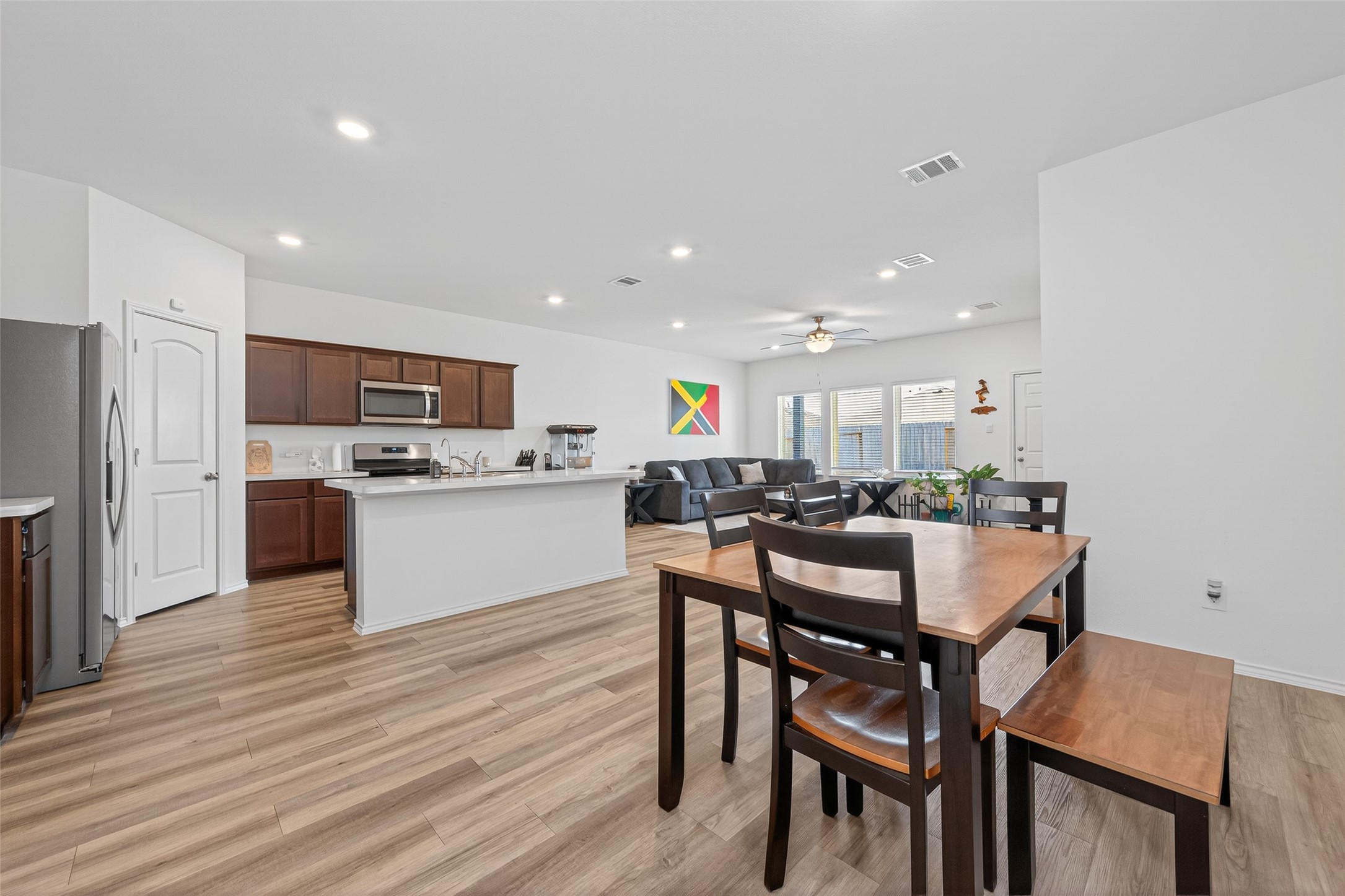 23532 Nectar Crest Heights Splendora, TX 77372 - Photo 6 of 21 a view of kitchen with cabinets table and chairs