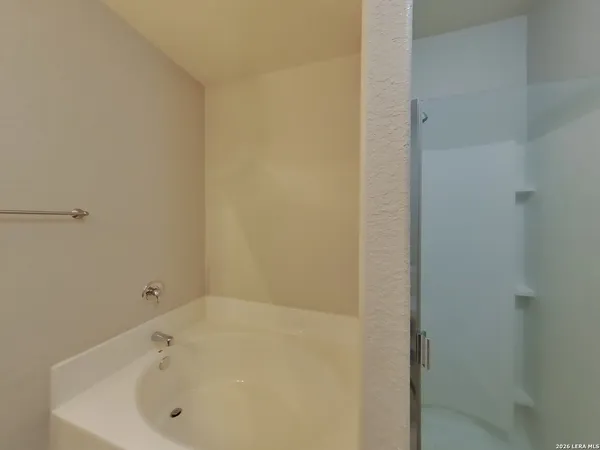 a white bath tub sitting in a bathroom