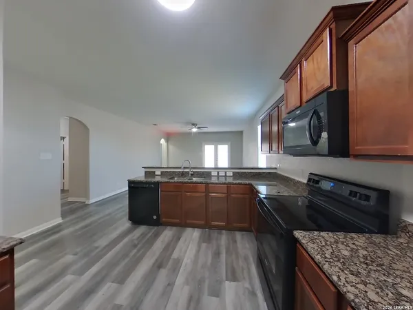 a kitchen with lots of counter top space and stainless steel appliances