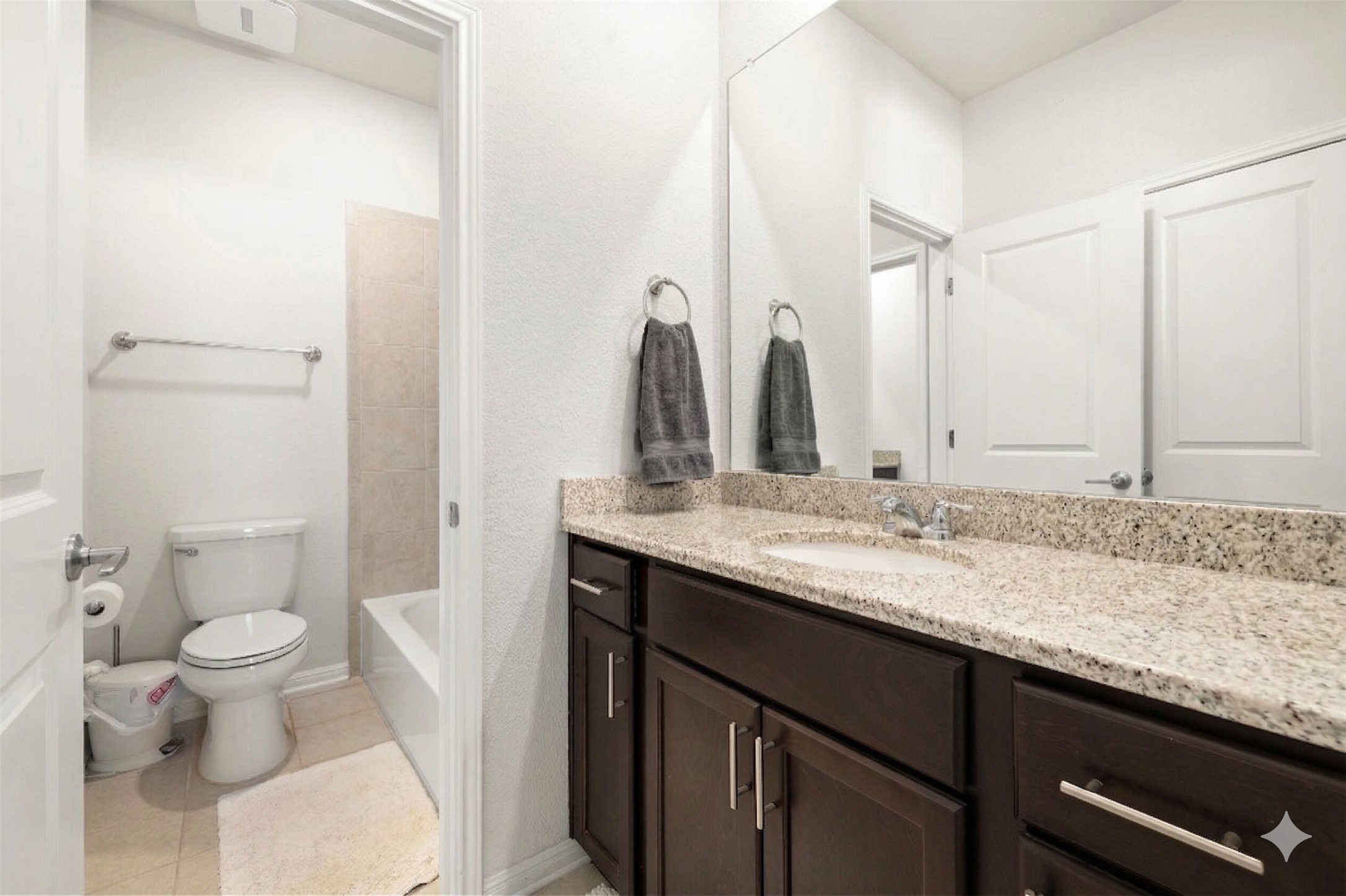 604 Spindrift Lane Leander, TX 78641 - Photo 22 of 32 Bathroom featuring vanity, light tile patterned floors, and shower / tub combination
