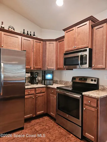 a view of a kitchen with granite countertop cabinets and sink