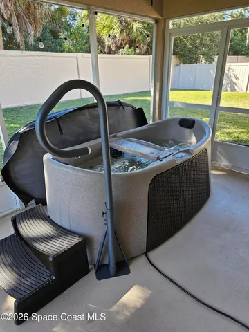 a view of a house with a swimming pool and a yard