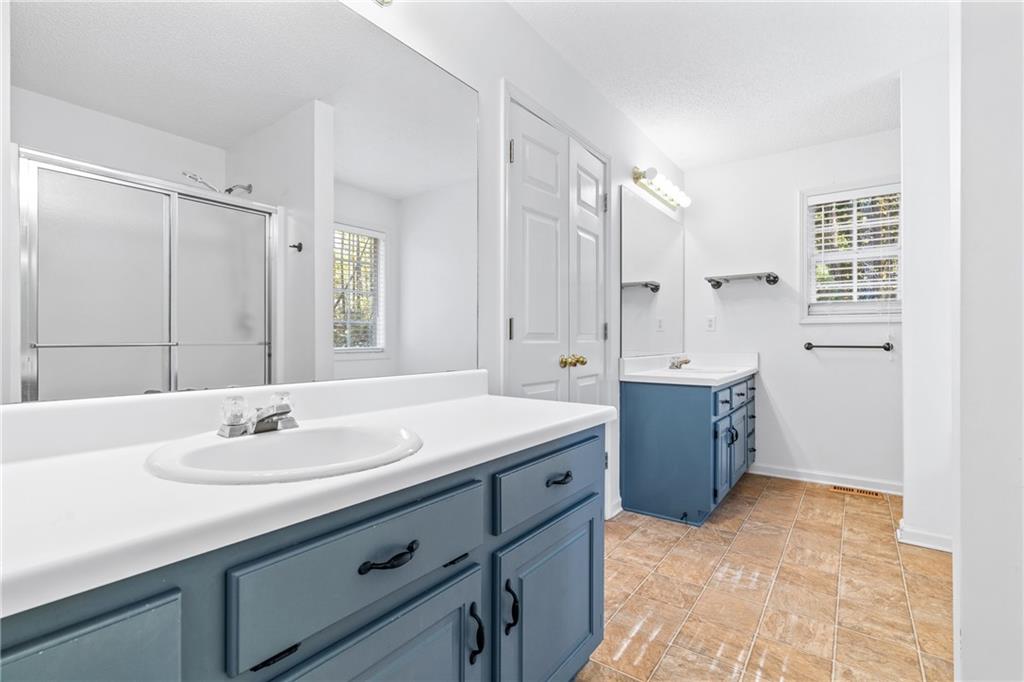 204 Red Fox Court Canton, GA 30114 - Photo 25 of 51 a bathroom with a sink double vanity and a mirror