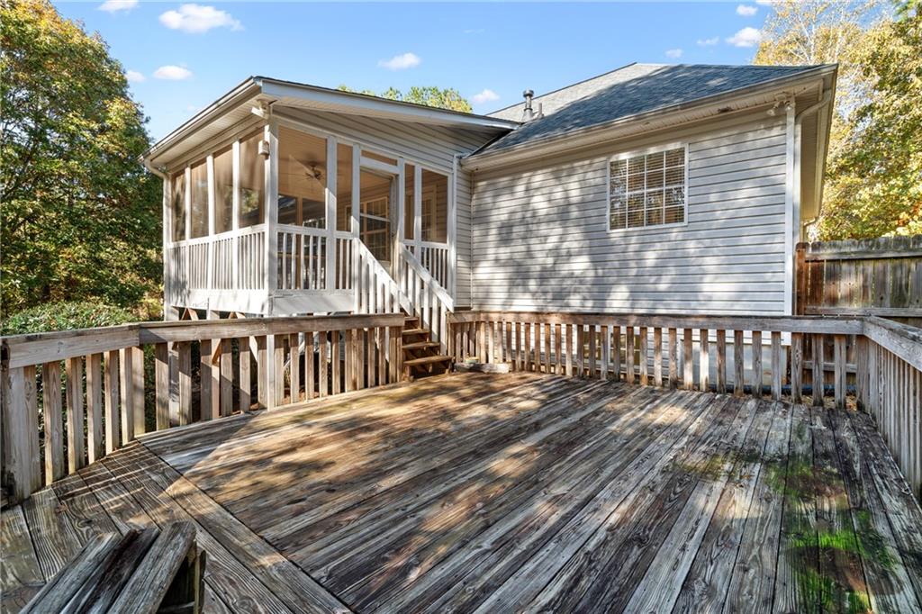 204 Red Fox Court Canton, GA 30114 - Photo 39 of 51 a view of a wooden deck with a yard